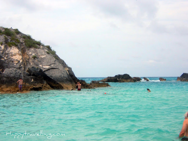 Bermuda ocean with giant rocks and people snorkeling