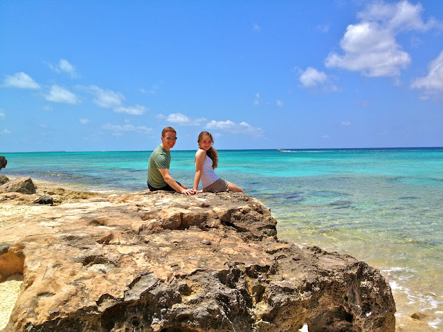 Father and daughter on the rocky beach of Grand Turk