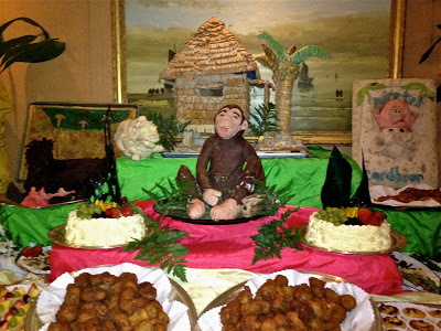 dessert buffet with monkey and hut sculpture