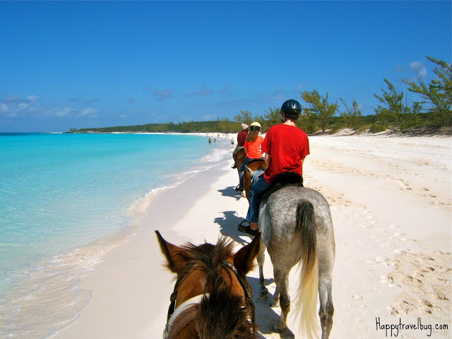 Riding horses along the beach