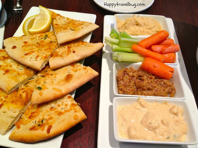 bread and veggies with 3 dips
