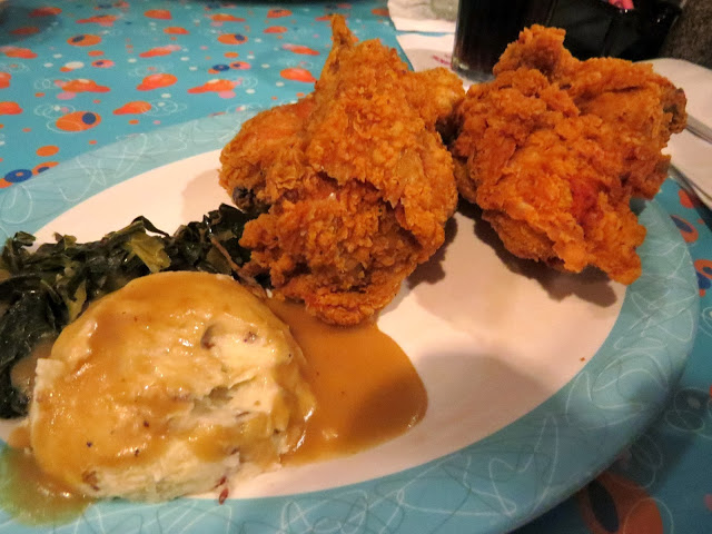 Fried chicken, mashed potatoes and gravy and greens at the 50's Prime Time cafe