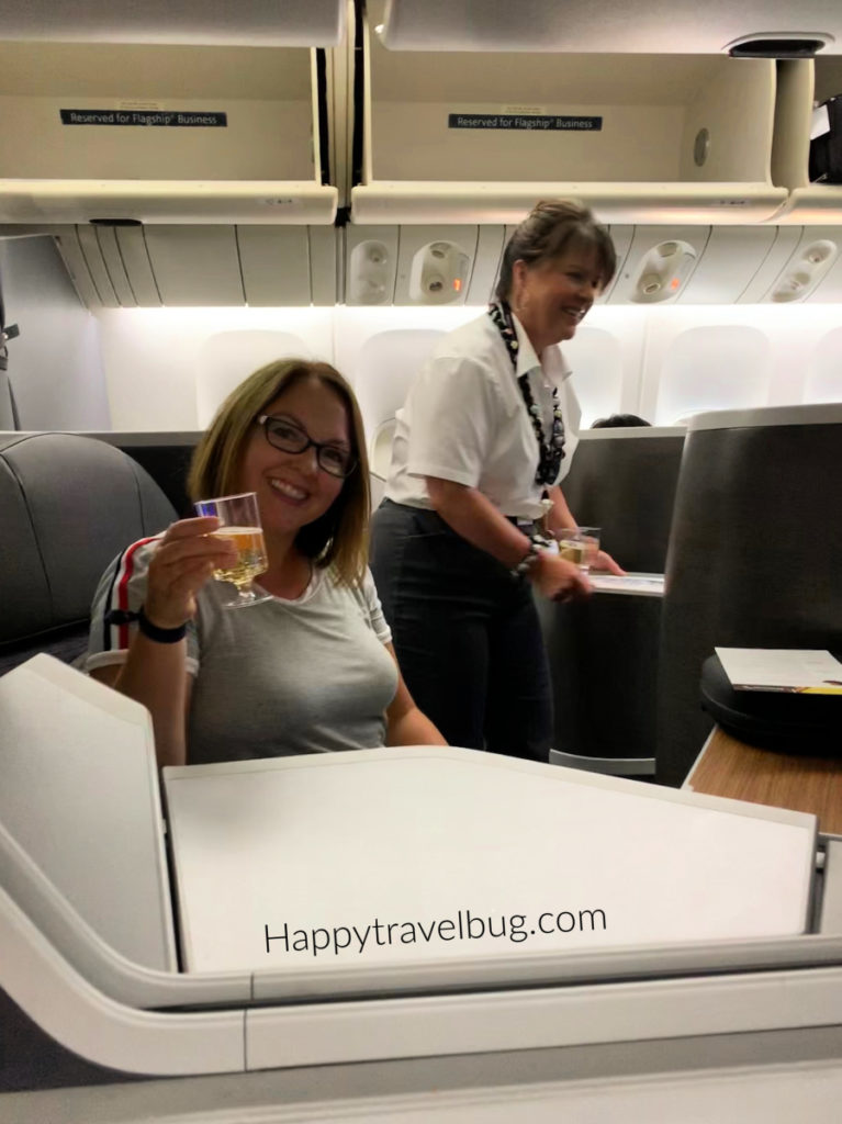 Woman drinking champagne on an airplane