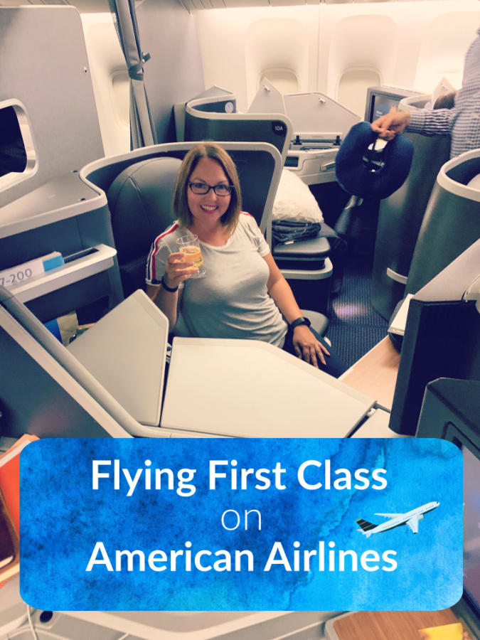 Woman sitting in first class section of an airplane