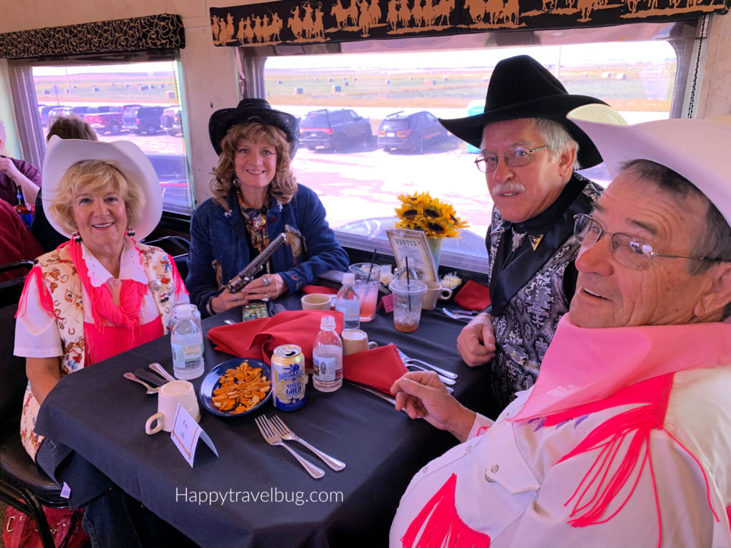 two cowboy and cowgirl dressed couples