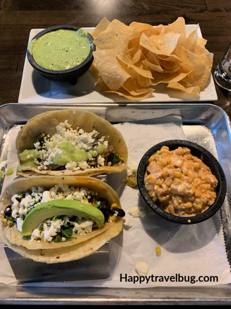tacos, mexican corn and chips and dip