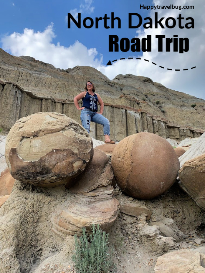 Giant stone balls and a woman in nature