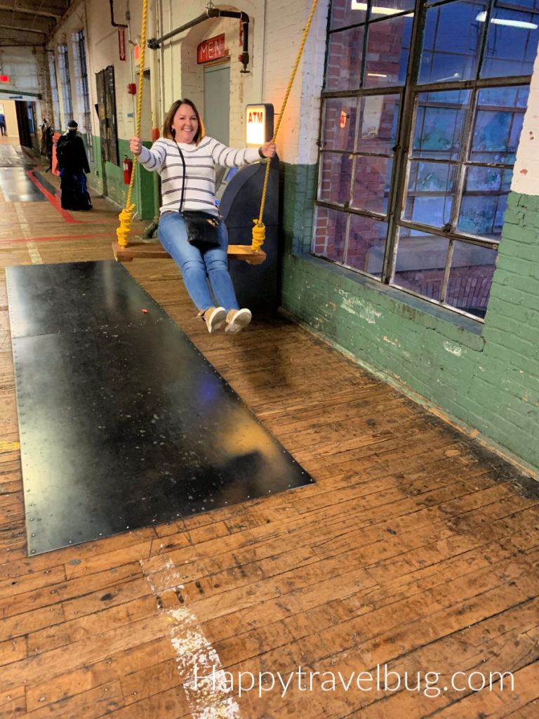 Woman swinging on an indoor swing