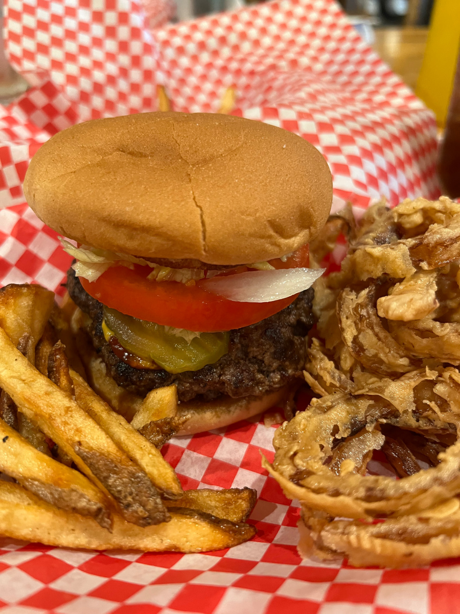 Hamburger with french fries and onion rings